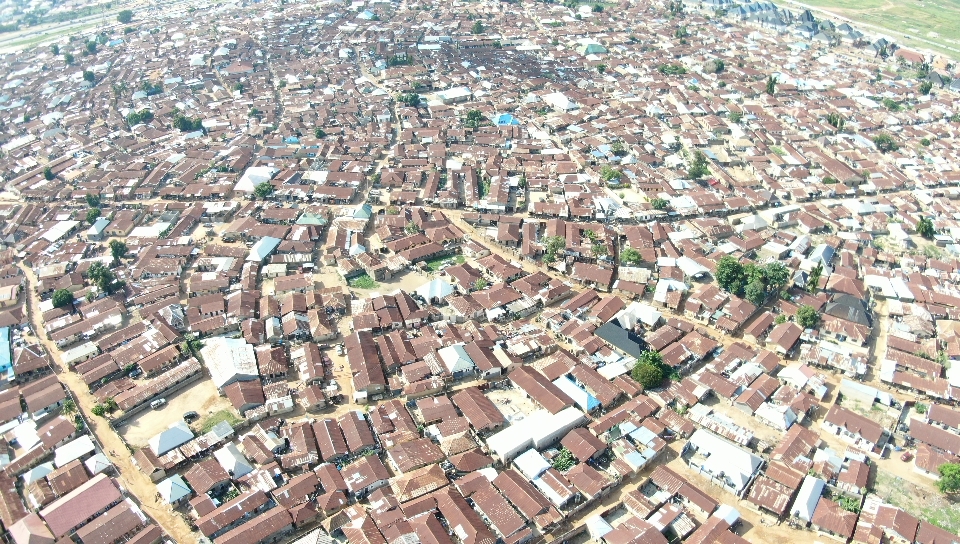 Wide-area aerial sweep over dense urban terrain