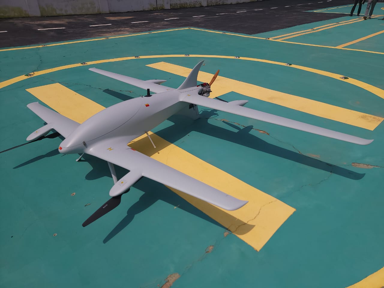 Long-endurance VTOL fixed-wing staged on launch pad